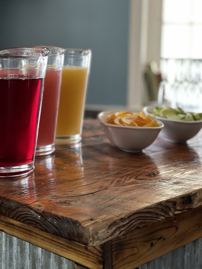 Juice glasses and snack bowls on a wooden bar