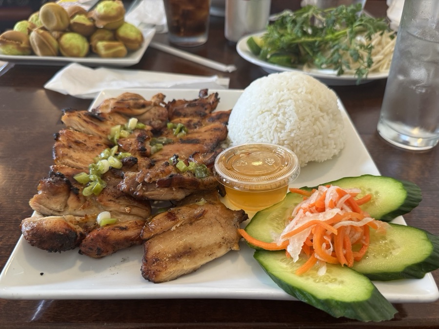 Grilled pork plate with rice, cucumbers, and pickled carrots