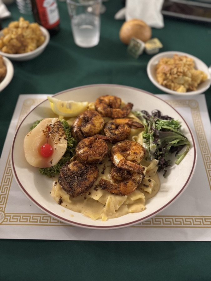 Blackened shrimp over pasta with sides