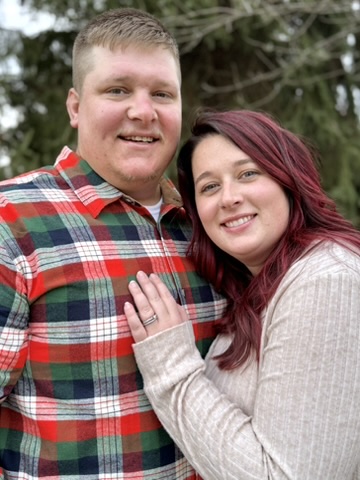 Couple smiling together in the fall