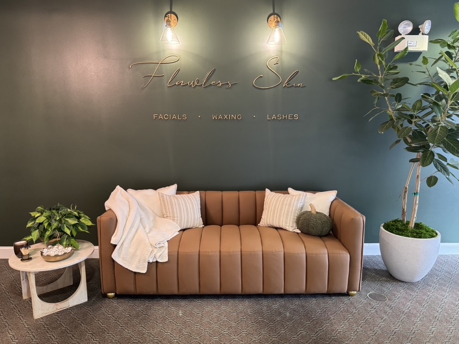 Flawless Skin spa lounge with a caramel leather sofa